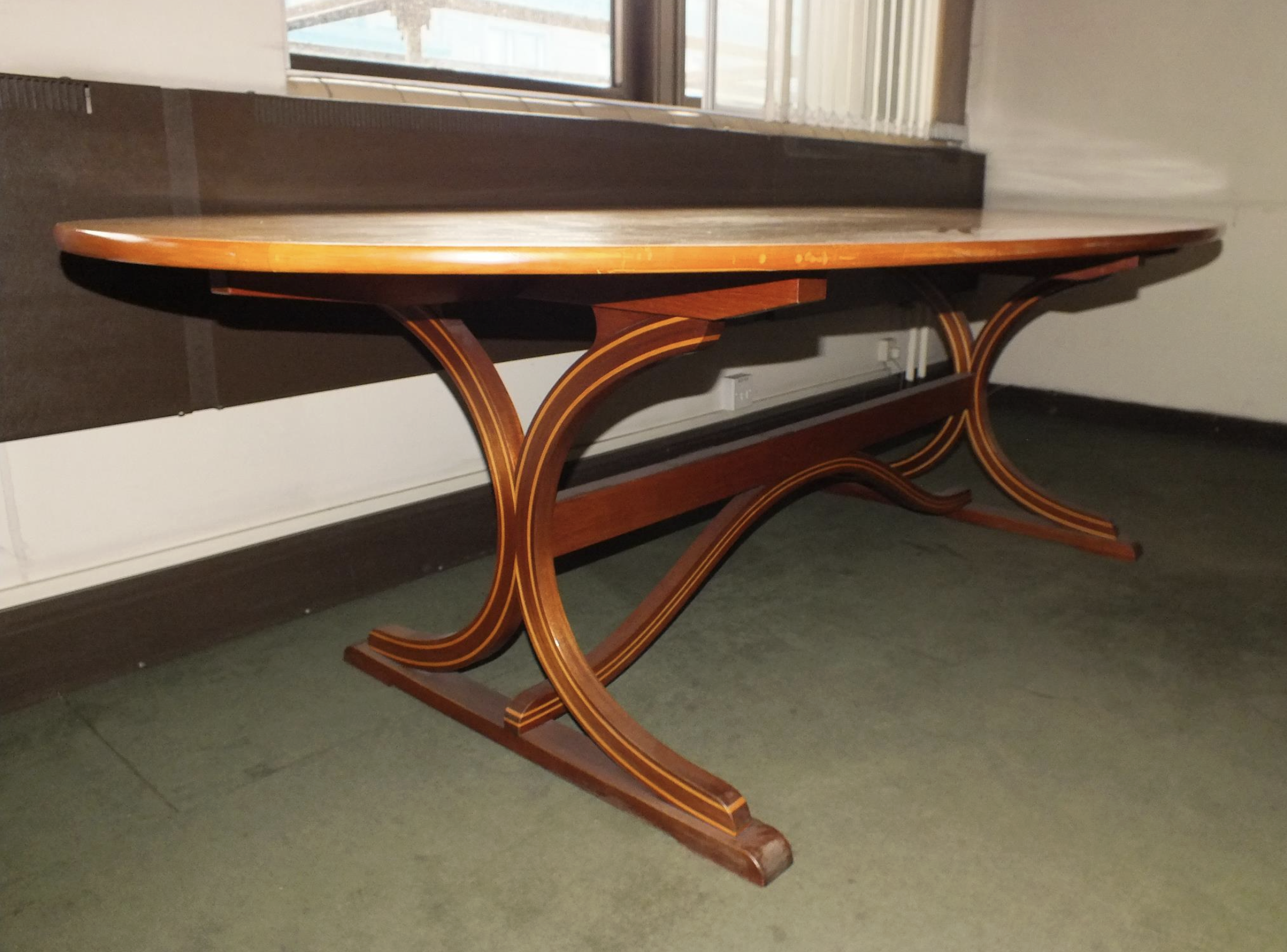 Boardroom table with a story up for auction