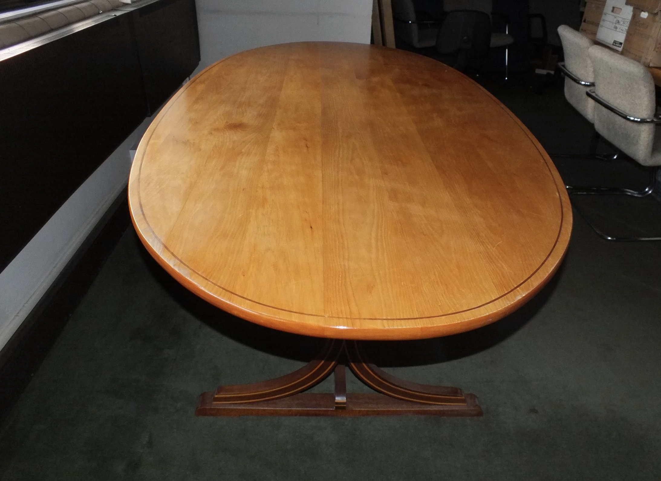 Boardroom table with a story up for auction